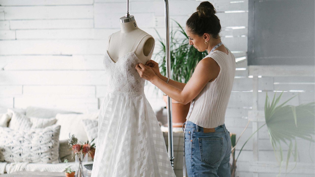 A fashion designer creating gowns; image used for HSBC Smart Loan Against Property page