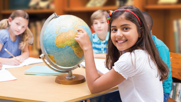 A girl is pointing to a globe; image used for HSBC Goal planning page.