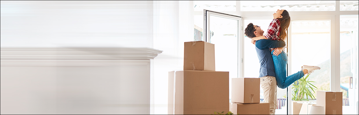 A couple embracing each other; image used for HSBC home loan page.