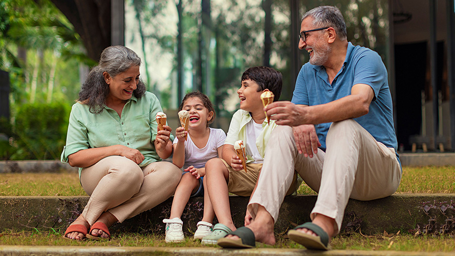 A man playing chess with his son; image used for HSBC India Insure Smart life insurance