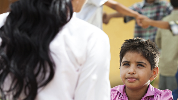 A boy watching his mother; image used for HSBC Goal planning page.