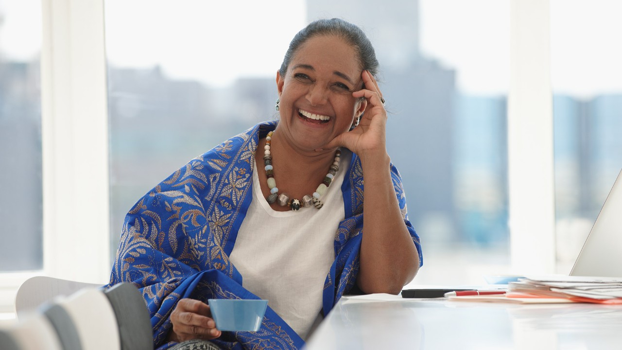 A woman with a cup; image used for HSBC India branches page.