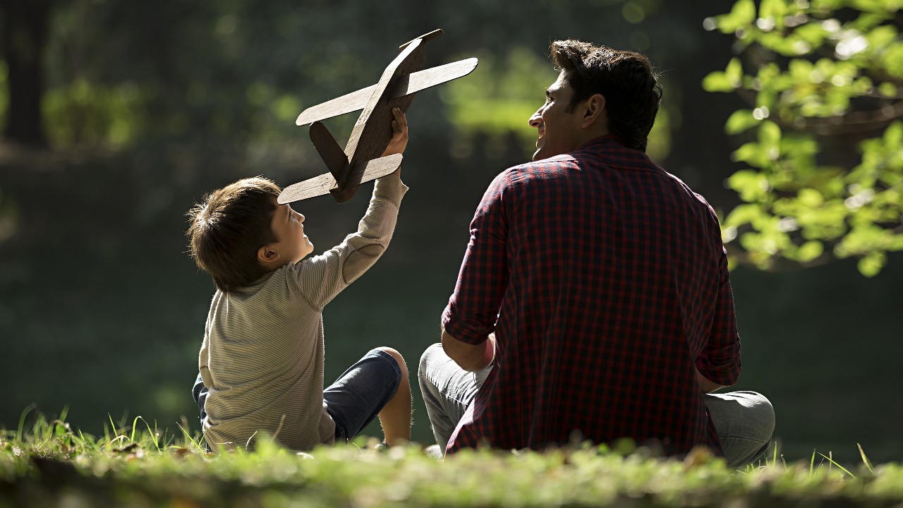 Father and son playing in the park; image used for HSBC Build emergency savings article