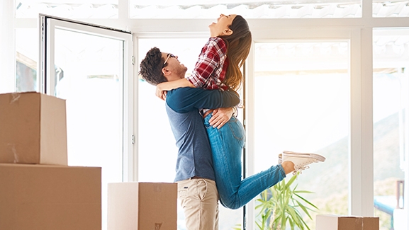 A couple embracing each other; image used for HSBC home loan page.