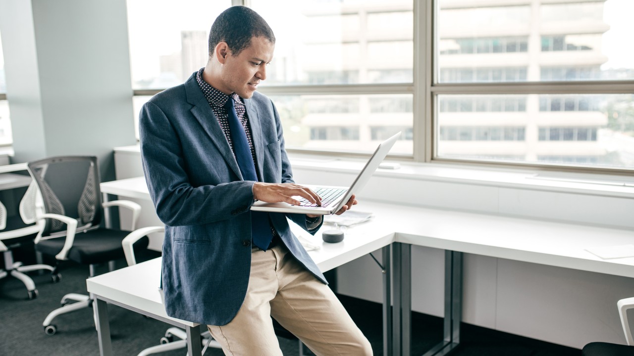 A man using laptop in an office; image used for HSBC investing in India