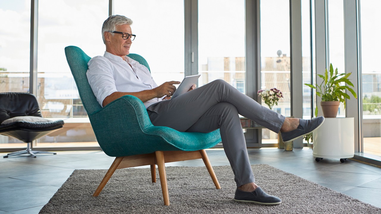 A man enjoying on the armchair; image used for HSBC India Save for the future article