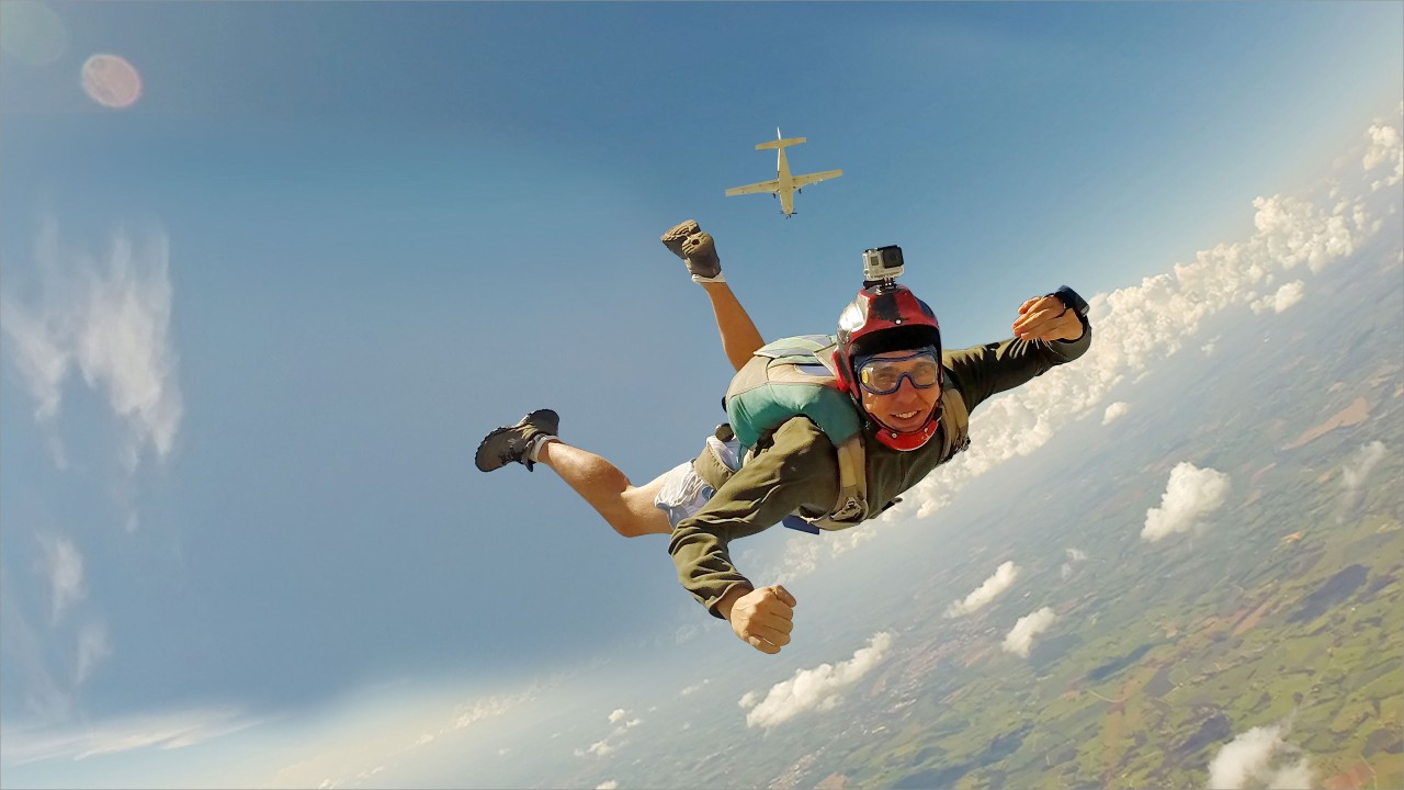 A man is skydiving; image used for HSBC Visa Platinum Credit Card.