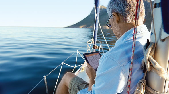 An old man is playing phone; image used for HSBC Goal planning page.