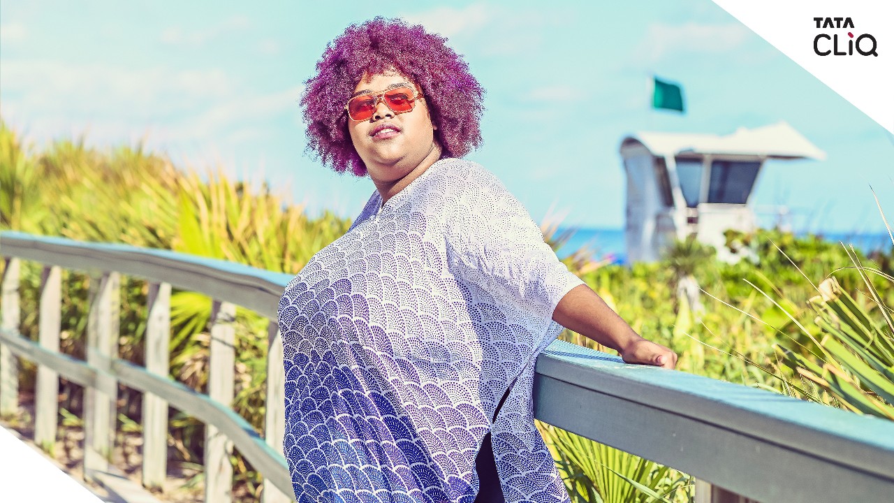 A woman enjoying the sun; image used for HSBC Tata CLiQ offer