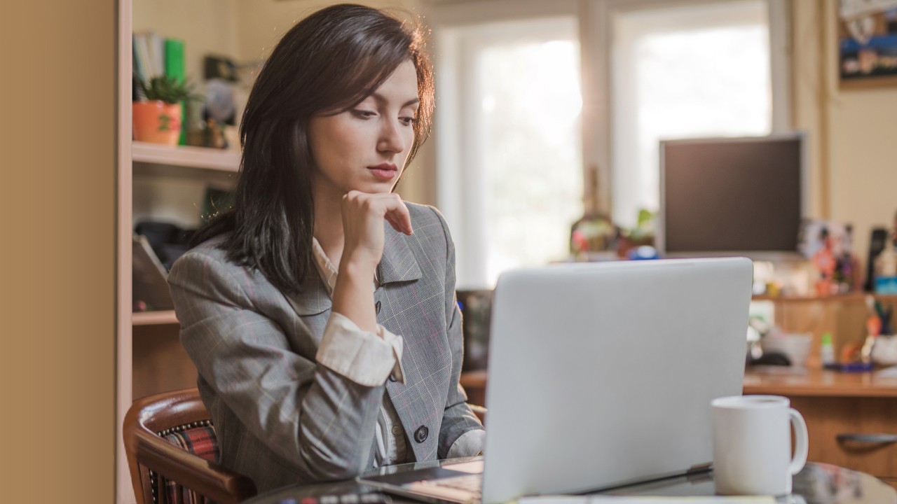 A woman using computer; image used for HSBC India Be aware of scams and fraud article