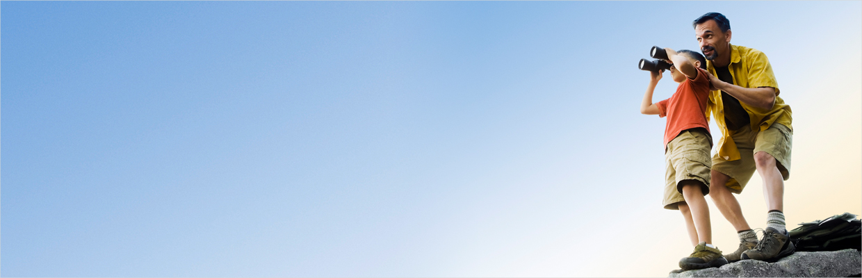 Father and son looking up the sky with binoculars; image used for HSBC Spend wisely article