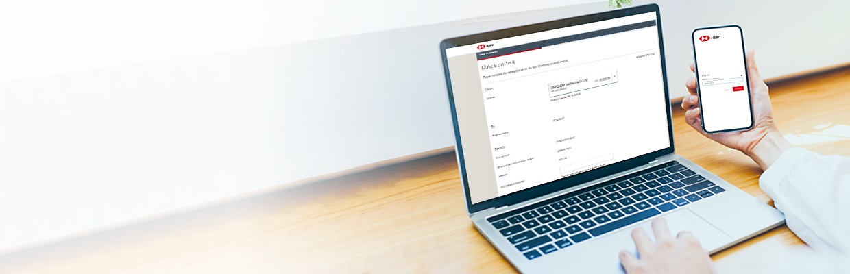 A mobile and laptop displaying HSBC banking services; image used for HSBC net banking payment gateway