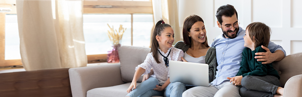 Parents happily with teenage daughter and little son; image used for HSBC India Plan for Buying a New Home page
