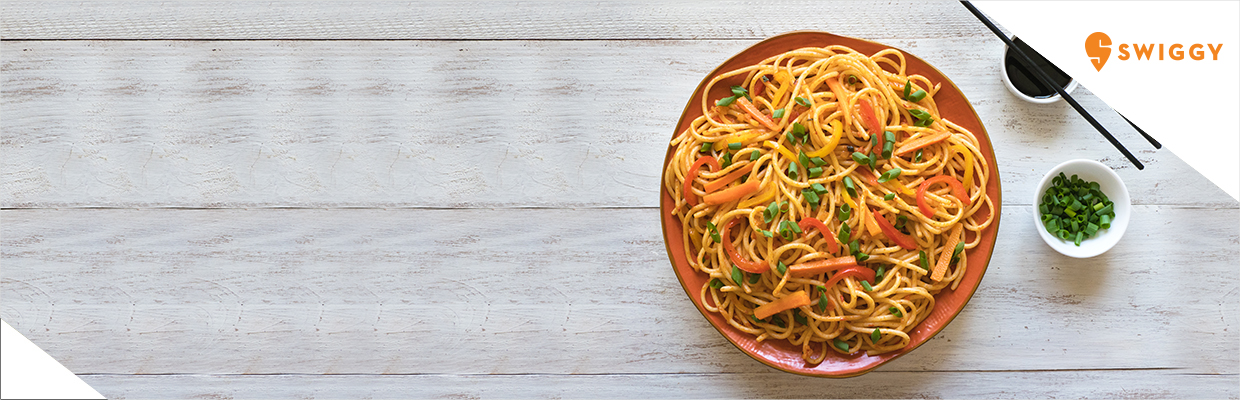 A delicious plate of noodles with chopsticks; image used for HSBC India Swiggy offer page.