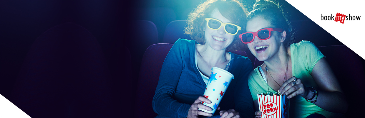 Two women watching a 3D movie at the cinema; image used for HSBC India BookMyShow offer page.