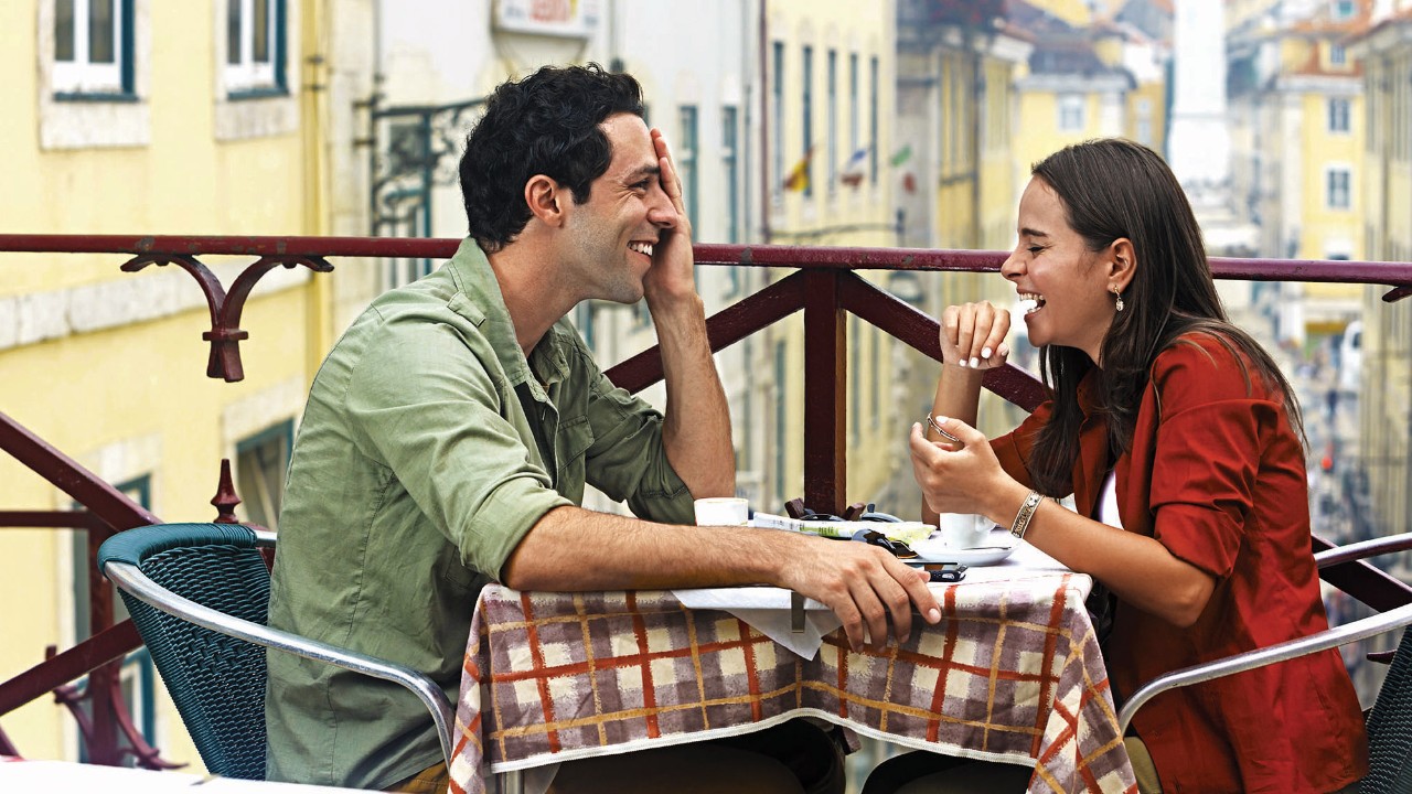 Cheerful couple in the cafe; image used for HSBC Advance online tools page.