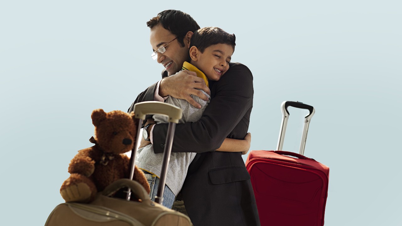 One boy and one girl hiking and girl looking behind and smiling; image used for HSBC Goibibo Offer.