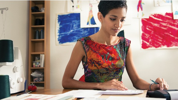 A woman handling business in office; image used for HSBC India  Small Business Banking Working Capital  page.