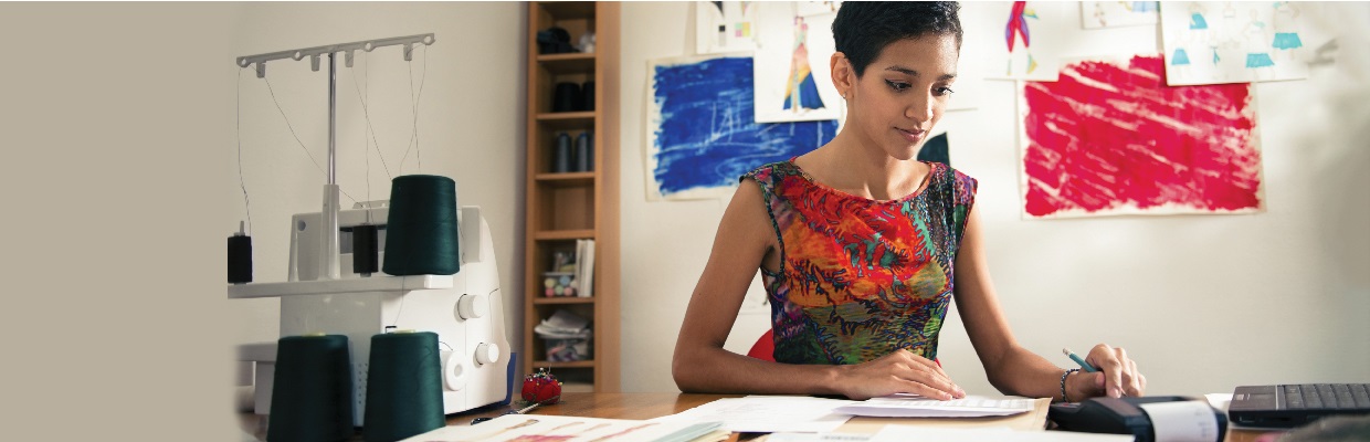 A woman handling business in office; image used for HSBC India SME Working Capital  page.